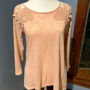 Pretty pink cotton top with lace embellishments on shoulders and back